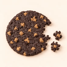 Dark chocolate cookie puzzle with tan chocolate chips